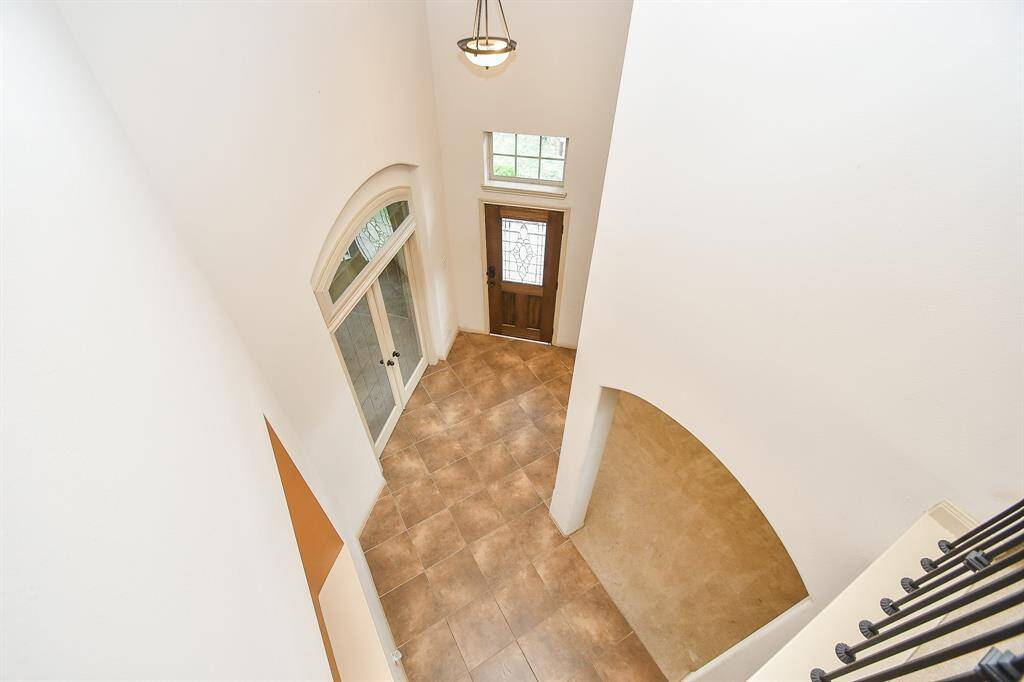 View of office, dining room & foyer from second floor.
