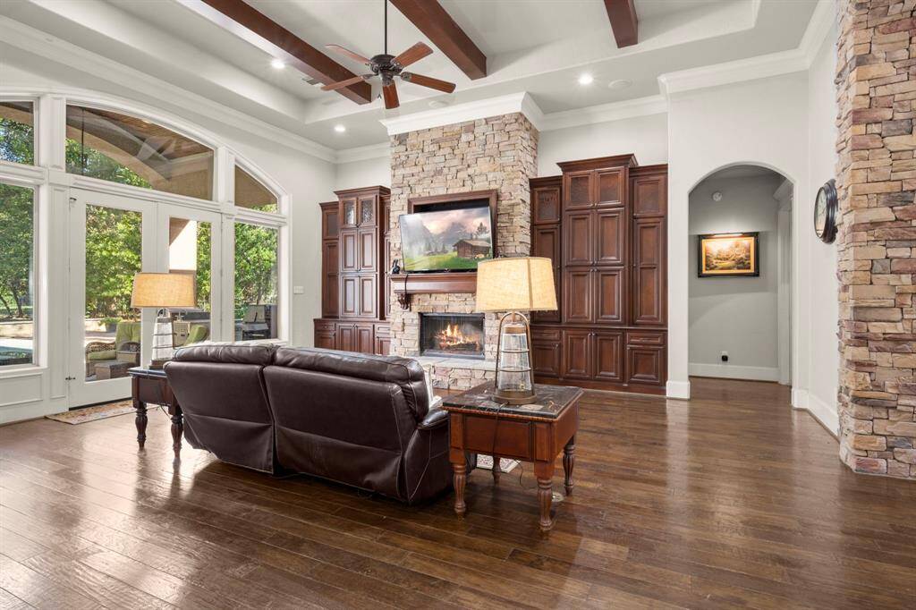 Tray ceilings and wood beams add elegance. Can lighting and ceiling speakers are the extra touches you'll find throughout this home.