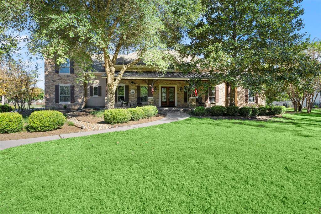 Wide, shaded front porch with gas light sconces, slate flooring and the foundation has an extra 3' elevation. Home has never flooded.
