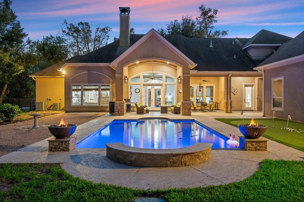 A putting green, pool with cascades and fire features, and extensive covered patio make for the Texas outdoor living you're seeking.