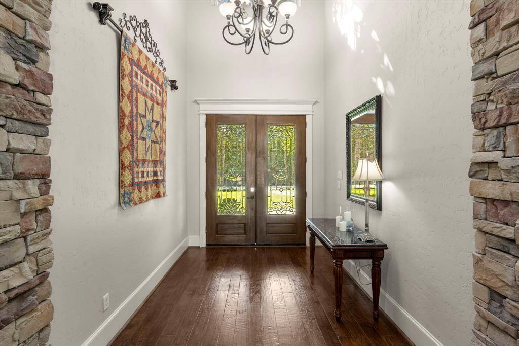 Note the millwork around the doors and windows, tall base boards, and grand ceiling heights.