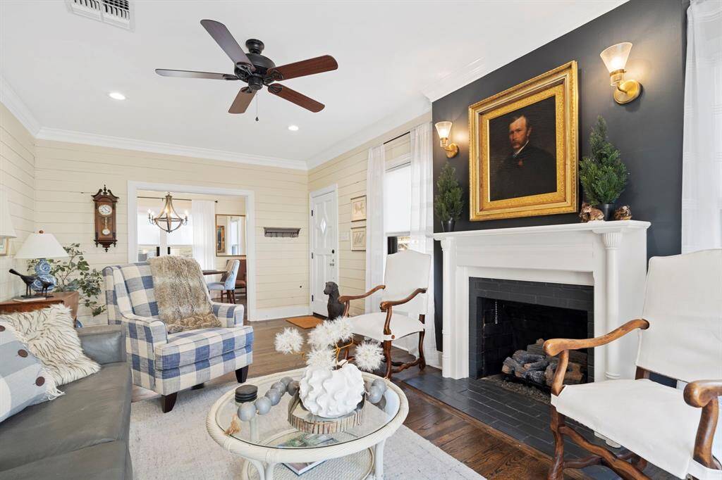 The party can easily flow from the open living room to the dining room.