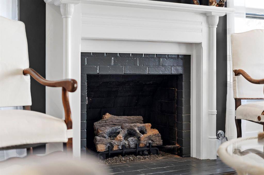 Fireplace with gas-logs has been newly vented and a chimney cap installed.