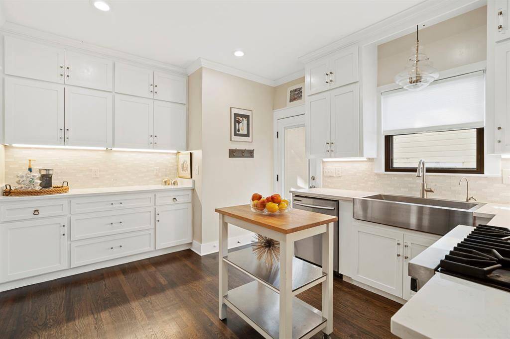 Custom cabinets go all the way to the ceiling maximizing storage space.