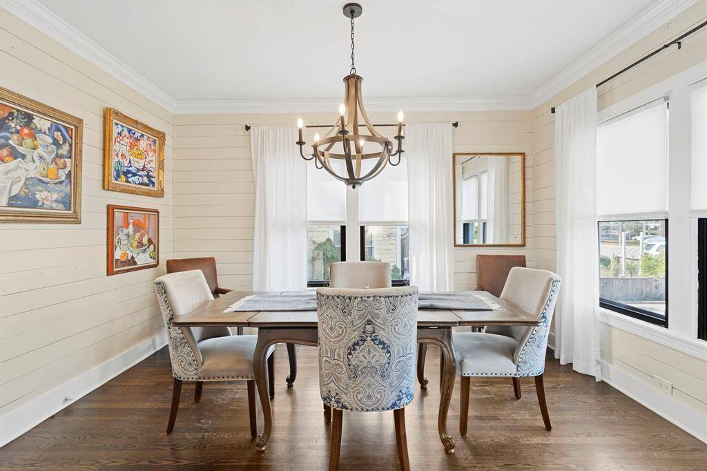 Create your own history in this classic formal dining room filled with natural light and a gorgeous rustic farmhouse chandelier.