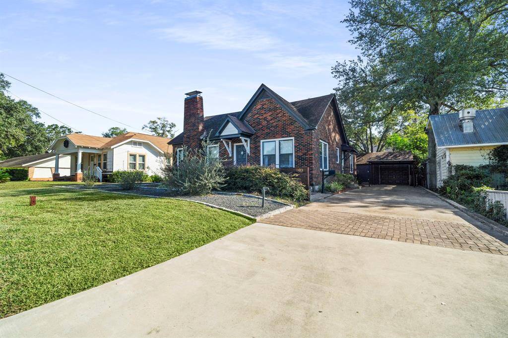 Home sits up high, has never flooded, and is set back from the road with a grassy area for outdoor activities.
