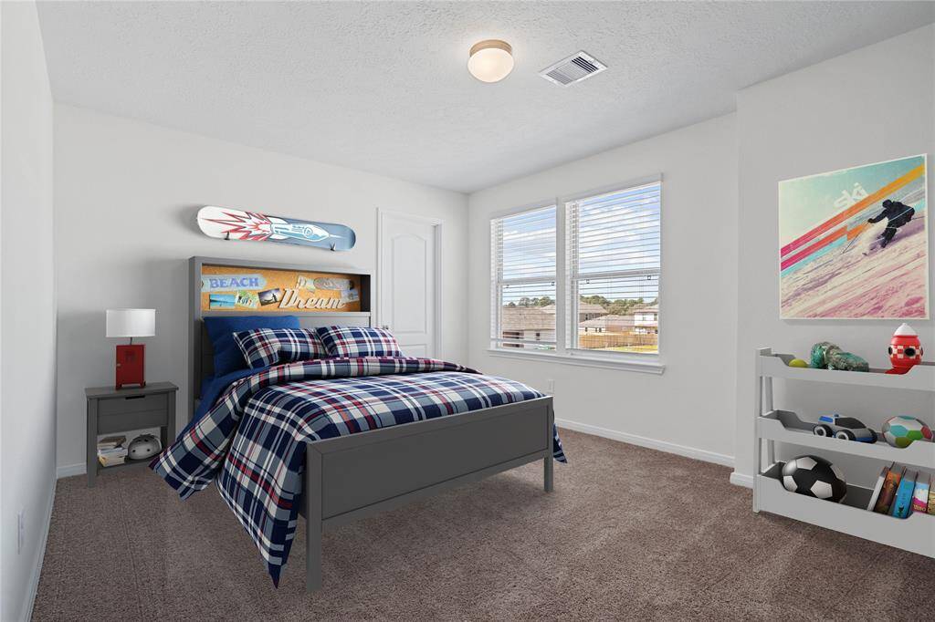 This secondary bedroom features high ceilings, custom paint, plush carpet, and large windows with privacy blinds!