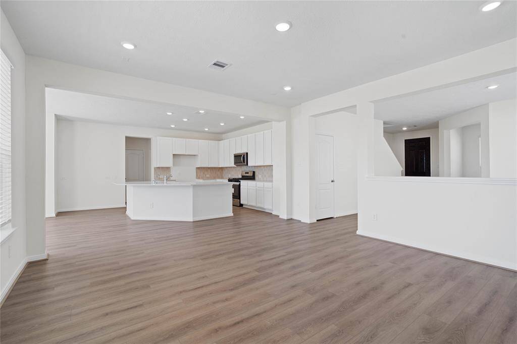 A gorgeous view from the Family Room into the kitchen.