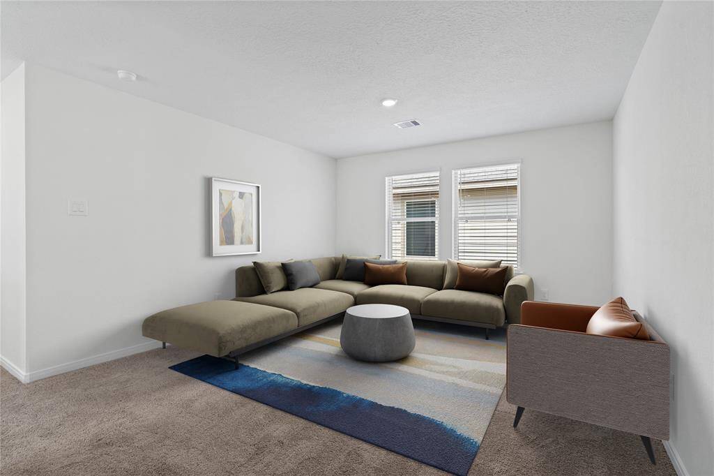 Come upstairs and enjoy a day of leisure in this fabulous loft! This space features plush carpet, high ceiling, recessed lighting, custom paint and large windows with privacy blinds.