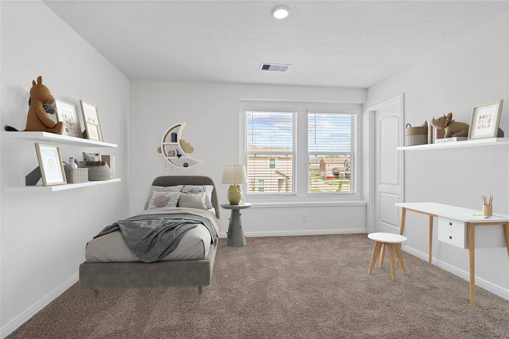 Secondary bedroom features plush carpet, neutral paint, recessed lighting, large windows with privacy blinds and a walk-in closet.