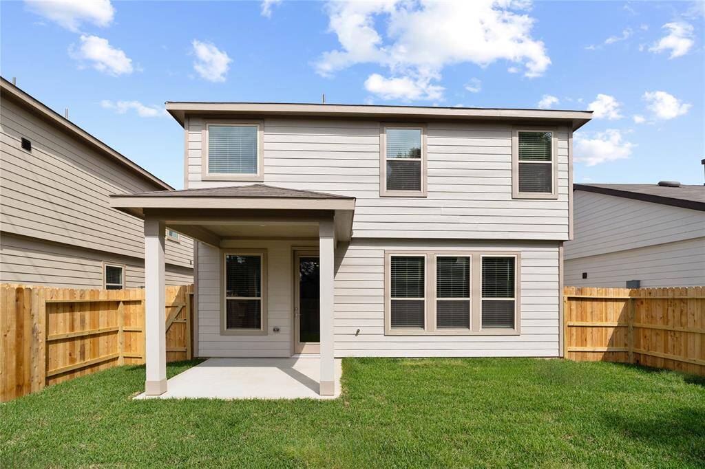 Come and see this spacious backyard with its beautiful covered patio. There is plenty of room for the kids to play and adults to relax!