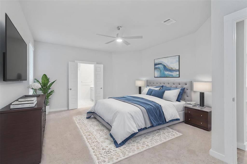 Come and unwind after a long day in this magnificent primary suite! This spacious room features plush carpet, warm paint, high ceilings with ceiling fan, and large windows with privacy blinds!