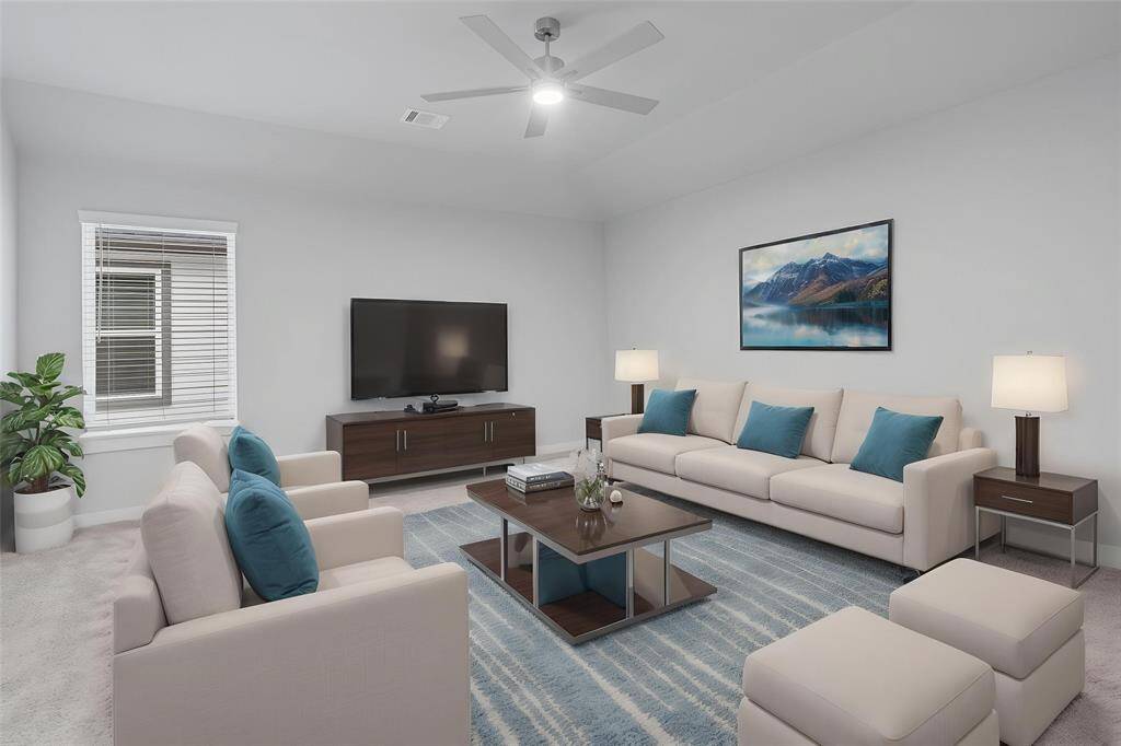 This spacious and bright game room features custom paint with gorgeous plush carpet, ceiling fan and a large window with privacy blinds! With the ample amount of space provided, you can turn this area into anything! From a media room to a children's play room, the possibilities are endless!