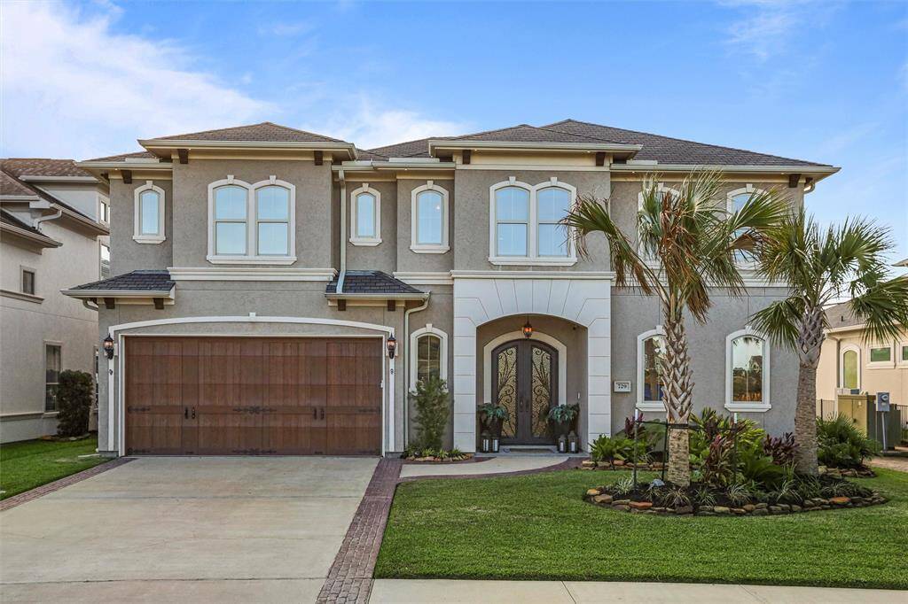 This stunning custom home boasts exceptional curb appeal, making it a true standout.