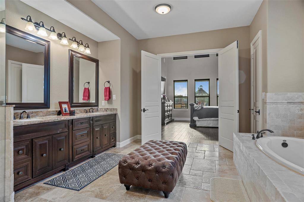 Elegant Primary Suite with dual sinks and abundant storage.