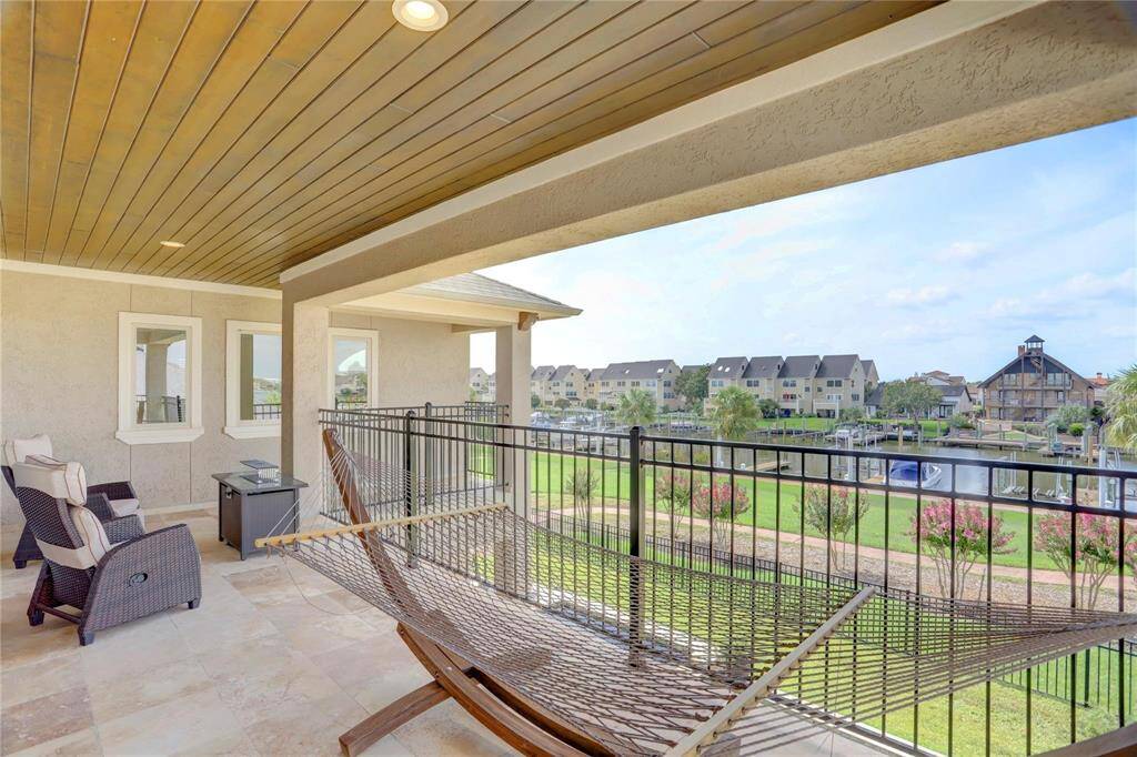 Enjoy stunning views and relaxation on this spacious upper deck.