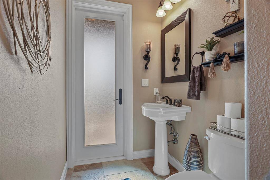 Elegant upstairs bath with stylish fixtures and ample natural light.