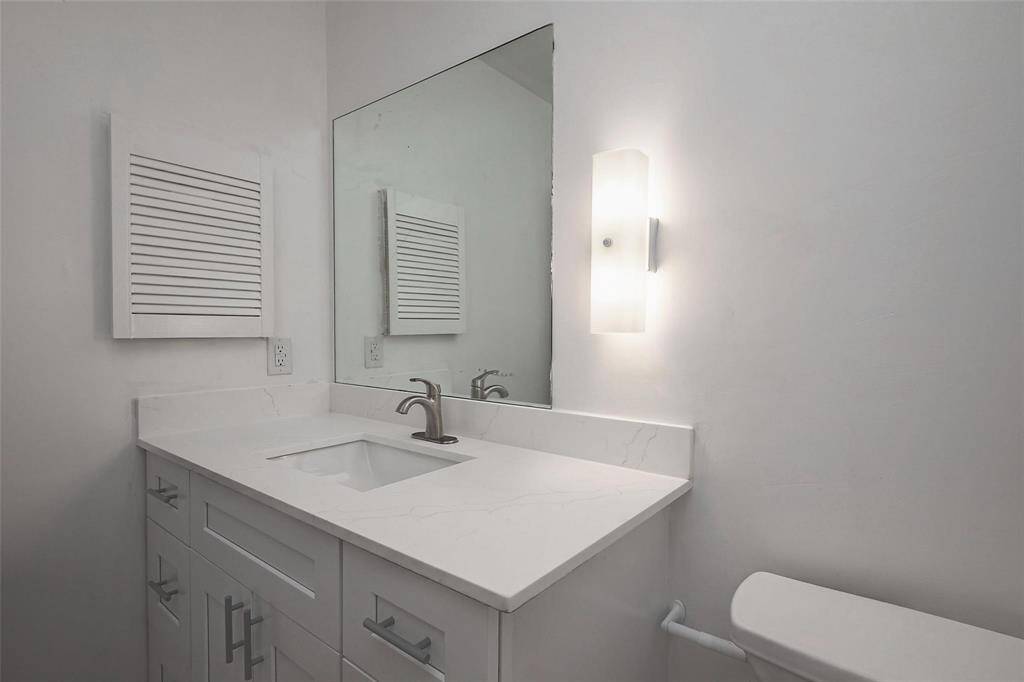 2nd restroom with all brand new cabinets and new fossette and undermount sink with quartz conter top
