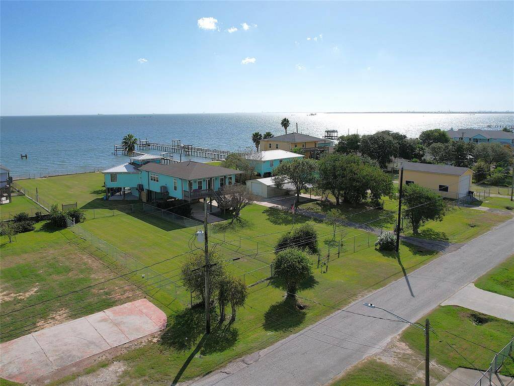 The fenced in lot is also part of the property! Utility hookups already available!