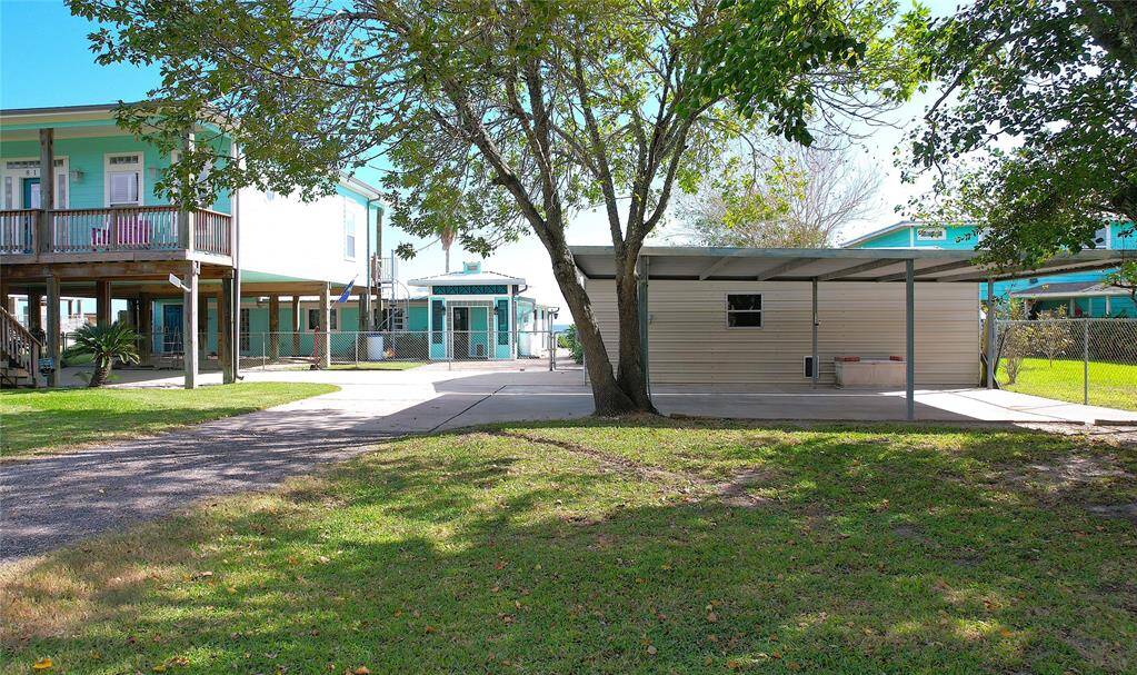 Carport and garage/workshop.