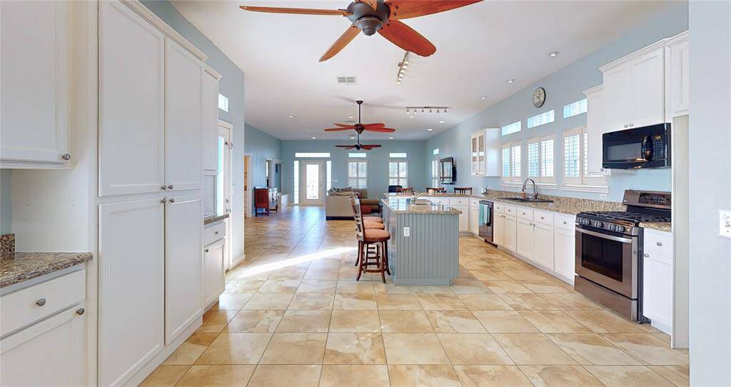 View of additional storage in kitchen, from the dining room area.