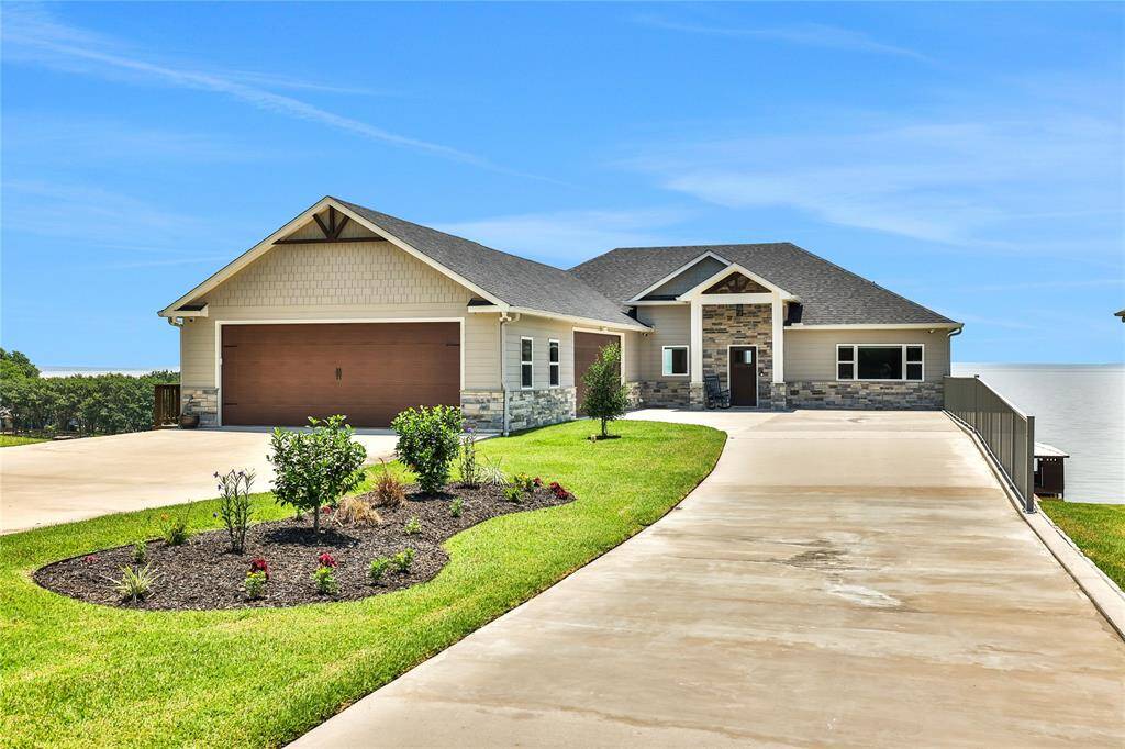 Welcome to 230 Legacy Boulevard - this beautiful open water home is located in the gated community of HeritageShores on Lake Livingston