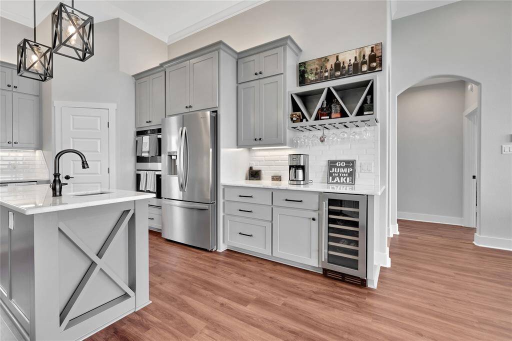 The kitchen has double ovens, wine refrigerator and dedicated coffee/wine station