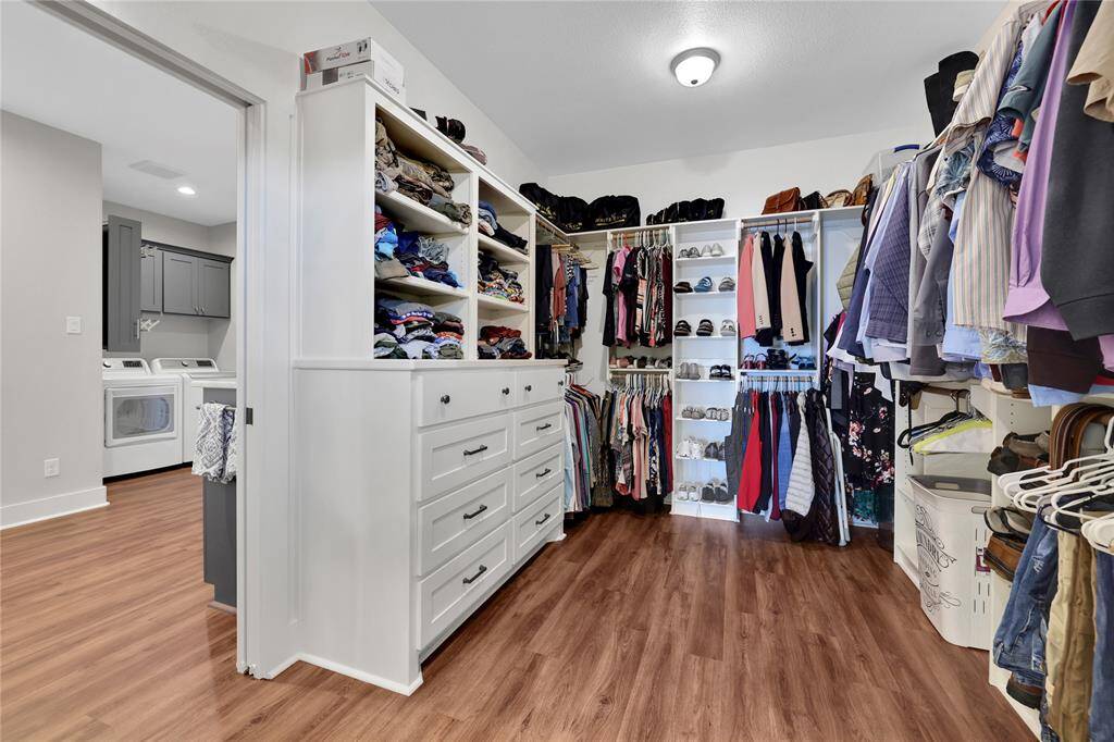 There is a large walk in primarycloset with custom cabinetry.There is also door access to the laundry room from the primary closet making laundry day a breeze!