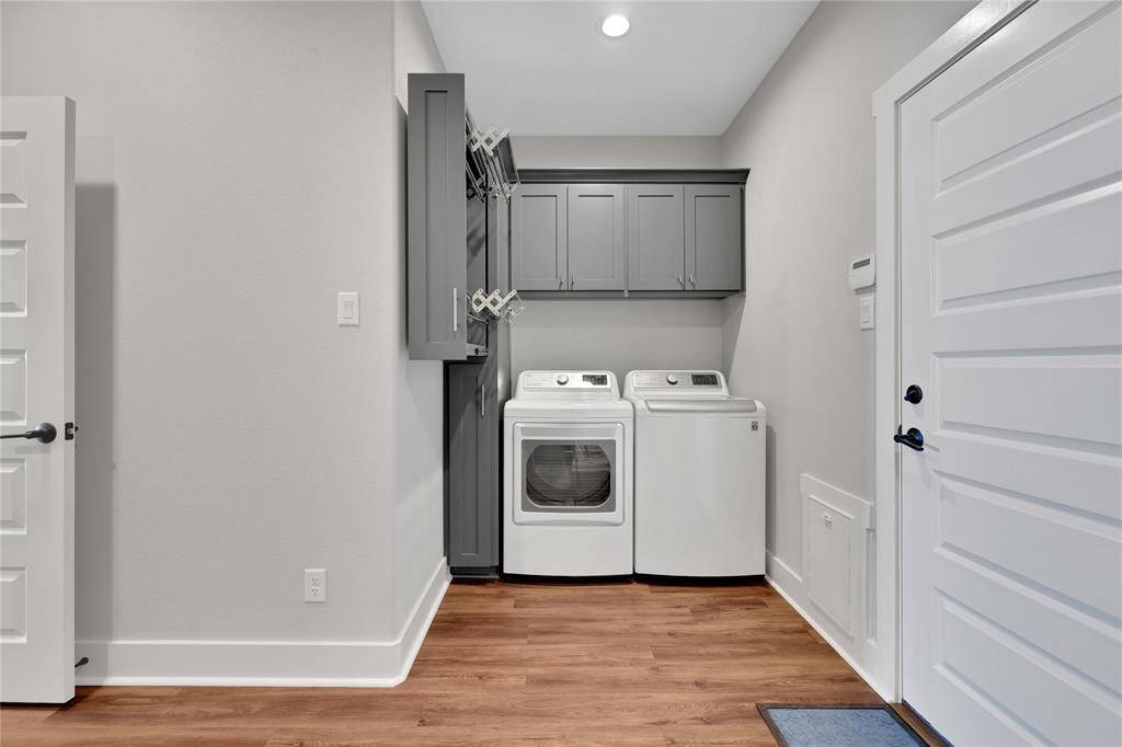 The laundry room has built in drying racks and access to the attached garage