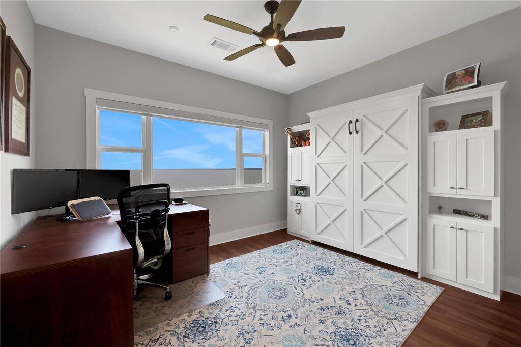On the main level there are two guest bedrooms - this one has a full size murphy bed and is currently being used as a home office