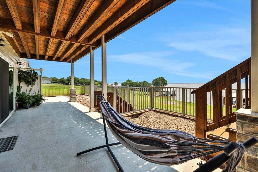Walk down the steps to the raised garden and back yard