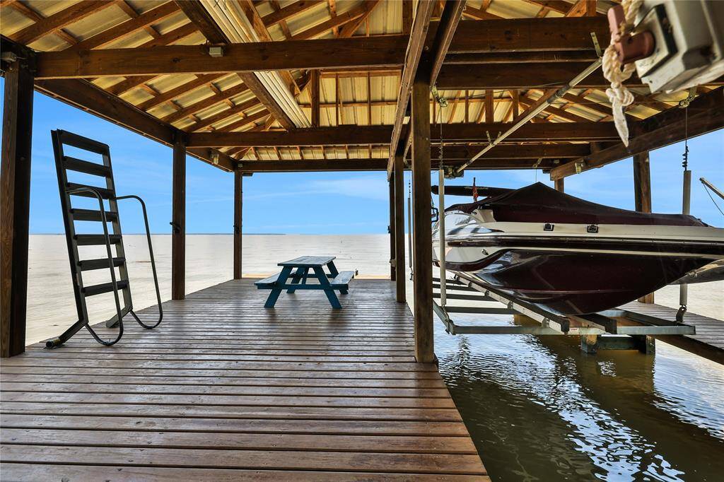 The boat house has a slip/lift for your boat, seating area and metal steps that can be lowered for swimming or floating in the lake