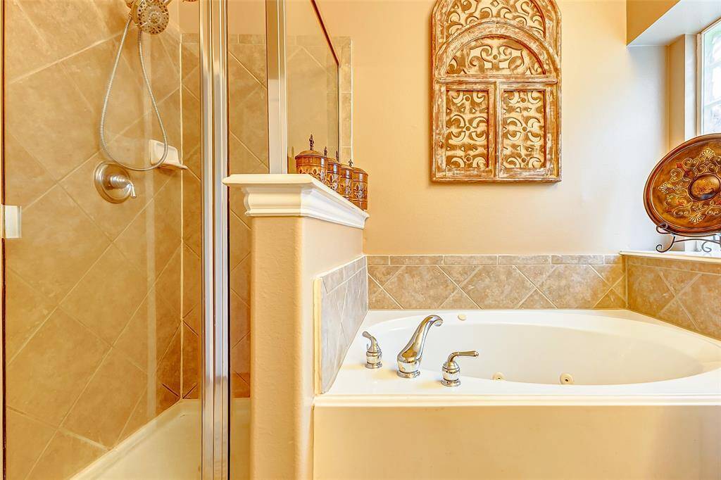 PRIMARY BATH INCLUDES TUB AND WALK IN SHOWER