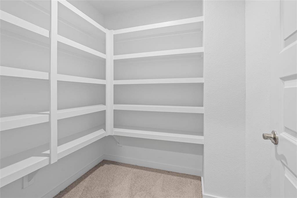 This feature of the home is a bonus for sure! This hallway closet has built in shelves!