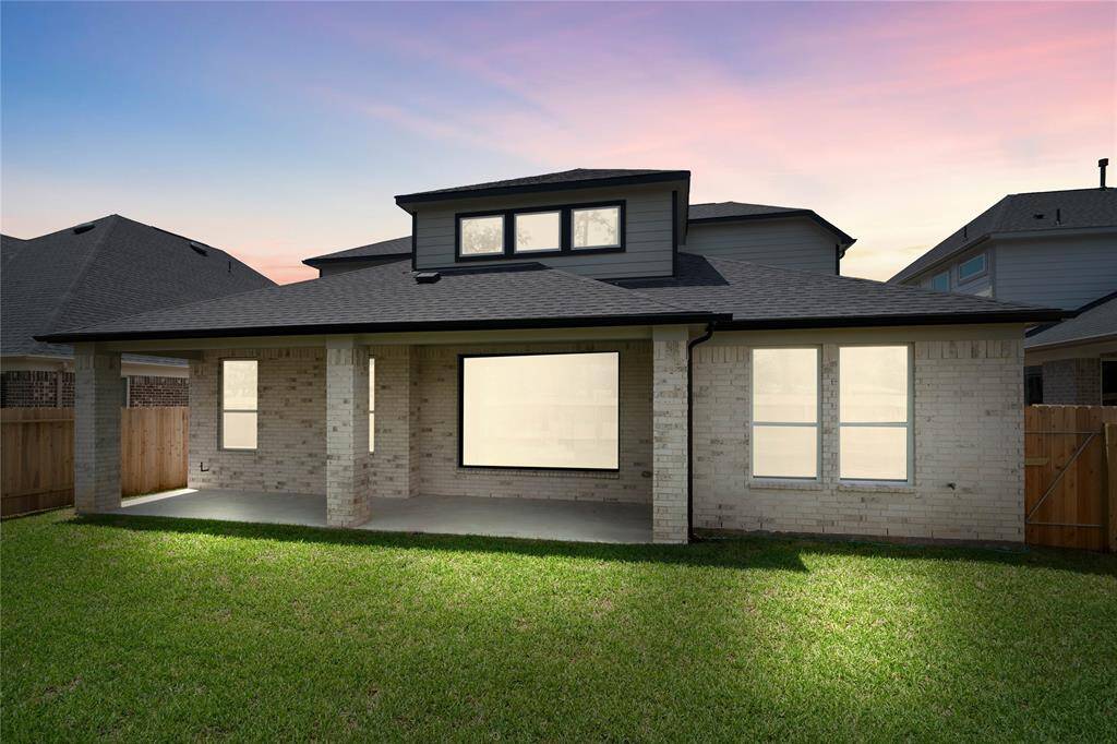 This backyard and covered patio is enjoyable for everyone! From pets playing, kids jumping on the trampoline, or even having a garden, this amazing backyard provides space for endless activities for the whole family!