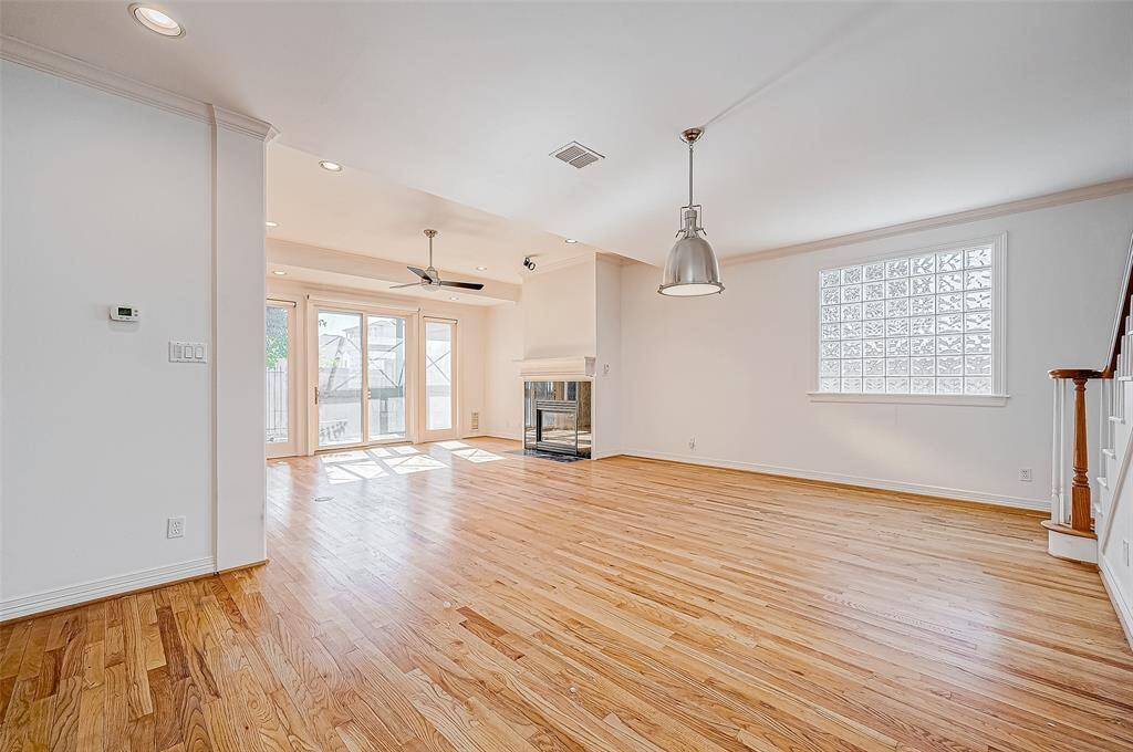 This view is the entry from the garage area going into this family room.   Notice the glass block window, adding extra interest, light and privacy.