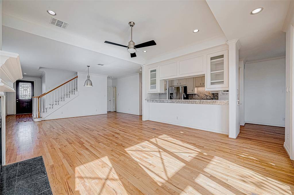 In this view you can see the front door on the left and the garage entry at the back.  Half bath and coat closet at the garage entry.