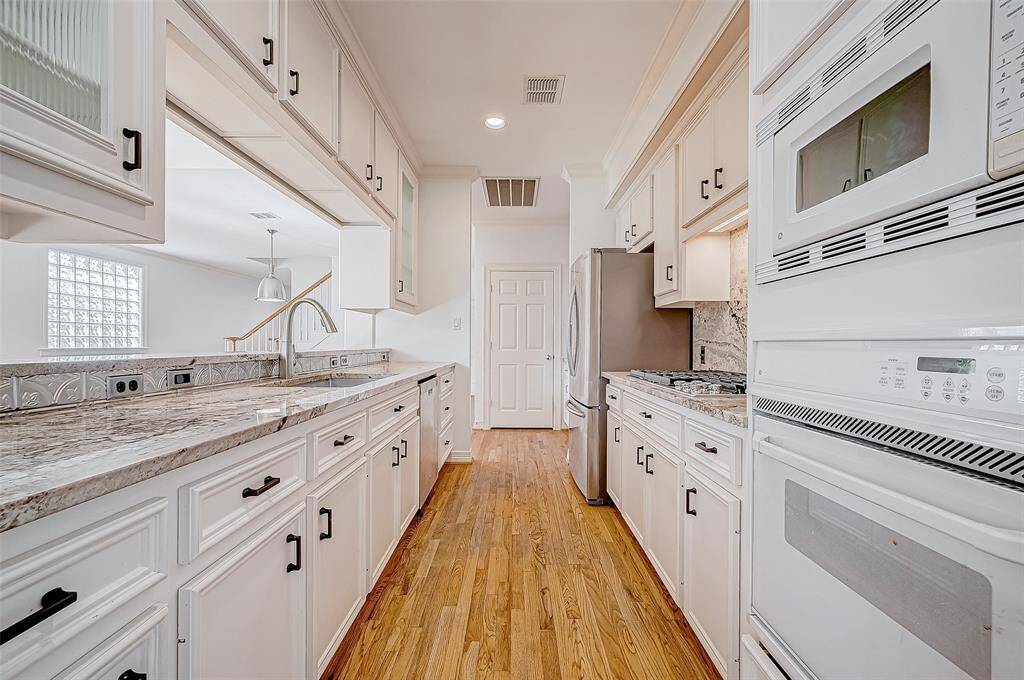 Galley style kitchen with easy access to both counters, sink and stove.