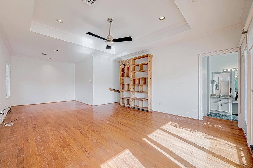 The huge master suite is a true retreat, featuring a sitting area, a luxurious master bath with dual sinks, a whirlpool tub, a separate shower, and a spacious walk-in closet.