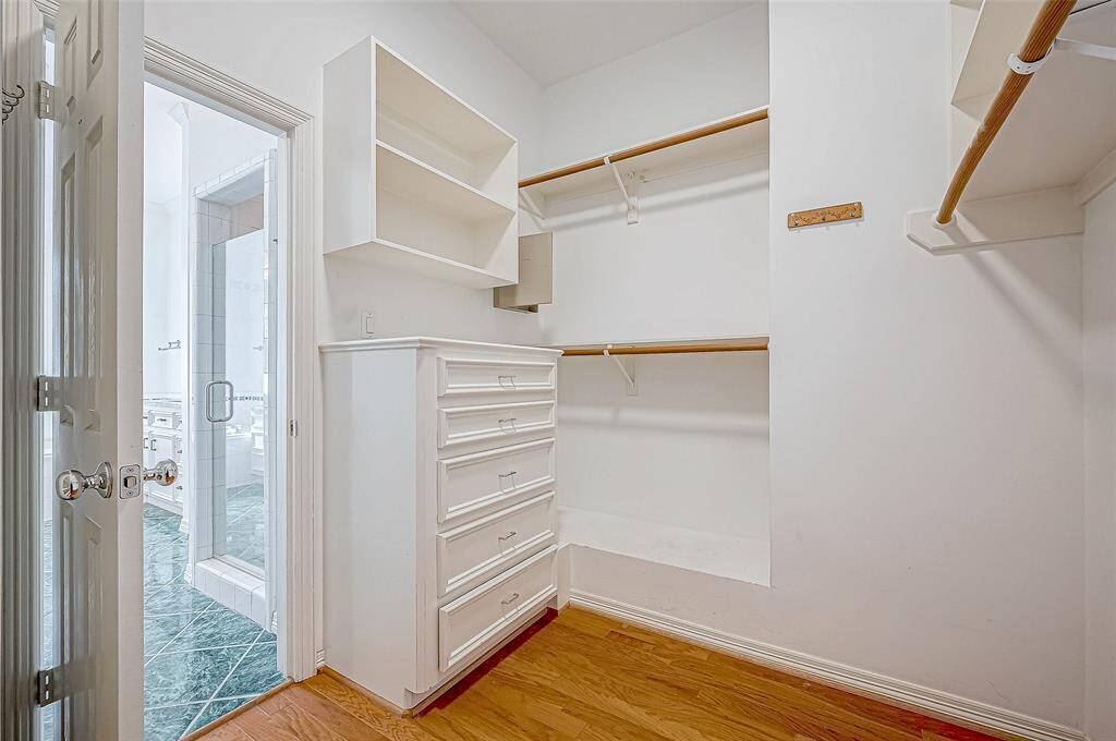 with built in dresser.   Shower pictured just outside closet.