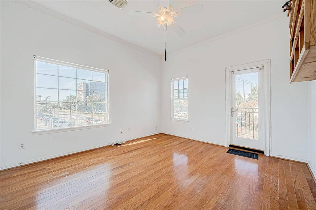 This bedroom was used as an office and artist studio because of the abundant natural light.  Front balcony view . . .