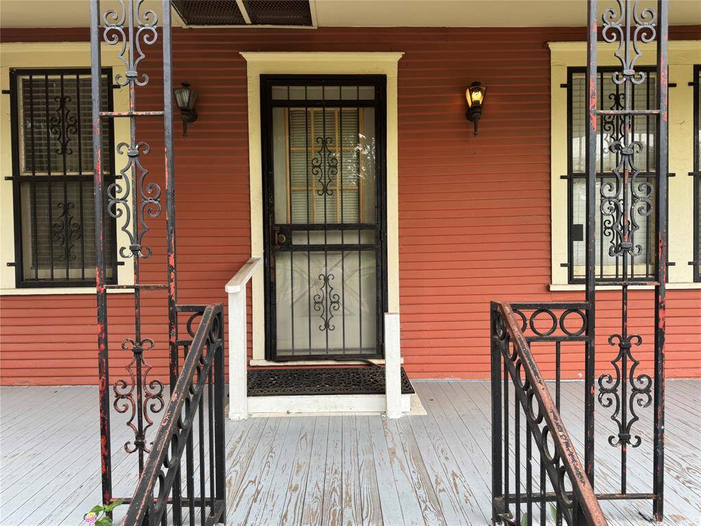 The front of the home is beautifully accented with custom ironwork.