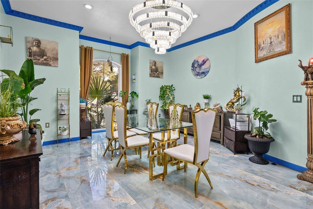 Formal dining with elegant chandelier, offers memorable dining experience