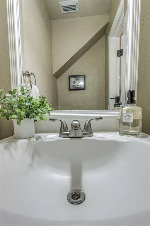 The half bath is conveniently positioned downstairs.