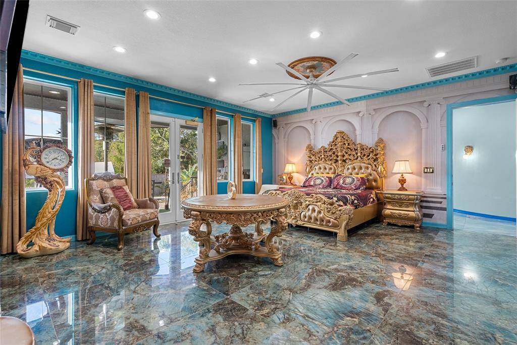 Primary bedroom with sliding doors to back yard paradise.