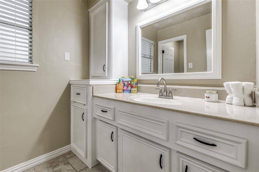 Vanity area of the secondary bathroom. This bathroom offers the convenience and comfort of a separate toilet and shower area.