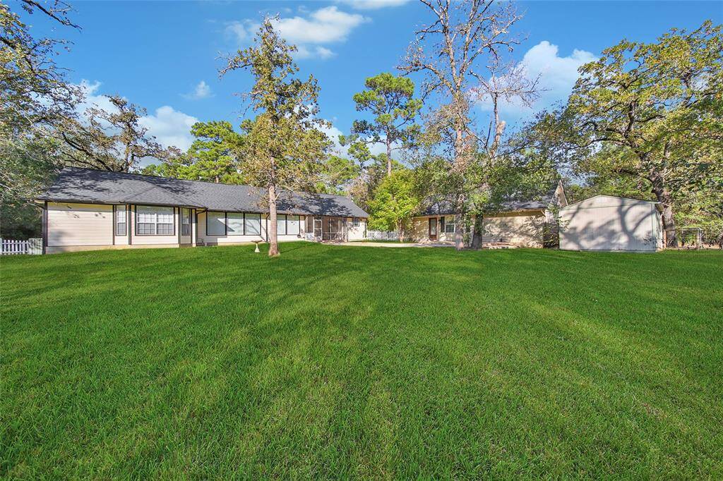 Shared Backyard with a country cottage and efficiency unit that are not included with the rent.