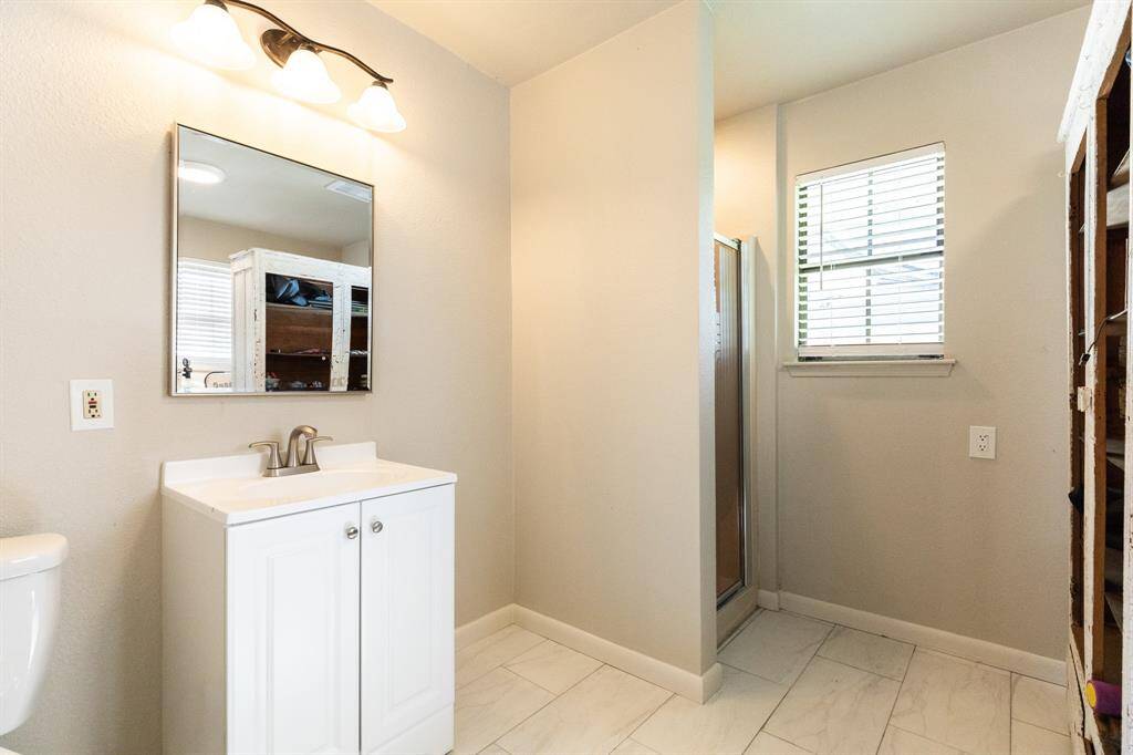 Enter the pool bathroom off the back porch.