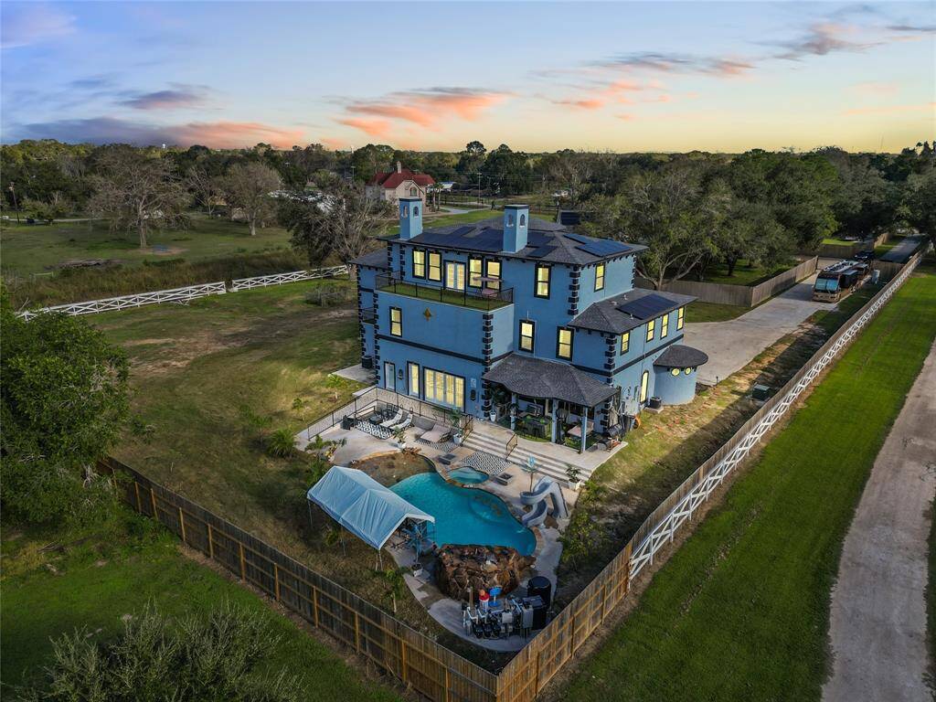 Twilight aerial ,looking toward the back of estate.