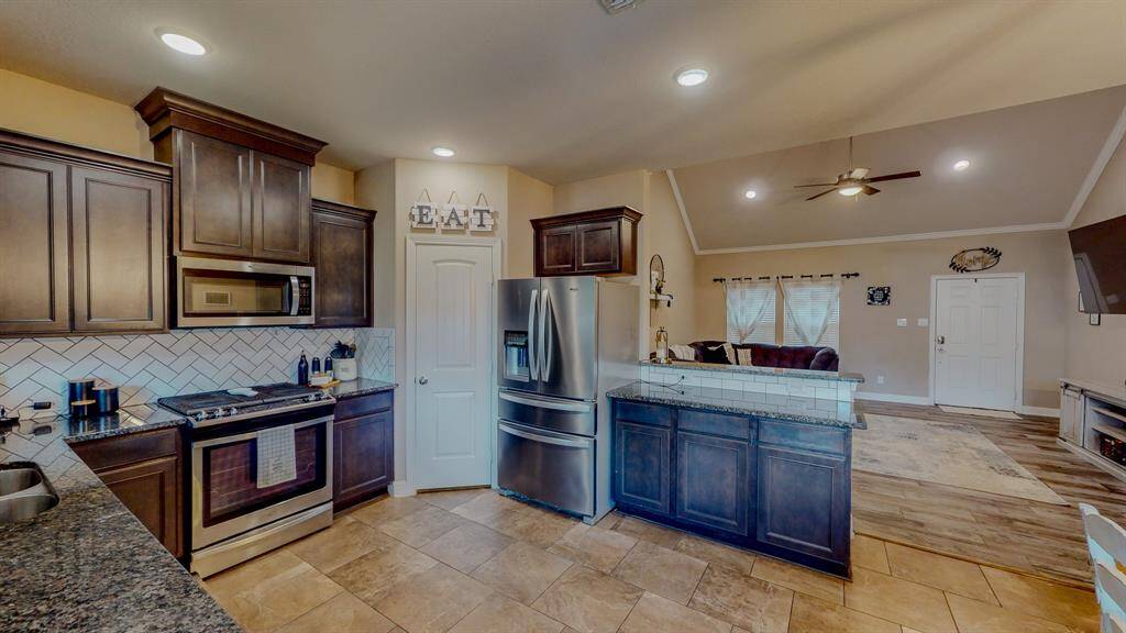 Kitchen opens into dining and living areas